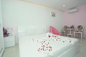 Postel nebo postele na pokoji v ubytování Bunny - Valentine Hotel - Bui Vien Street
