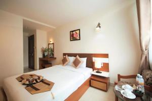 Postel nebo postele na pokoji v ubytování Bunny - Valentine Hotel - Bui Vien Street