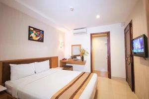 Postel nebo postele na pokoji v ubytování Bunny - Valentine Hotel - Bui Vien Street