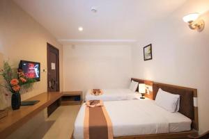 Postel nebo postele na pokoji v ubytování Bunny - Valentine Hotel - Bui Vien Street