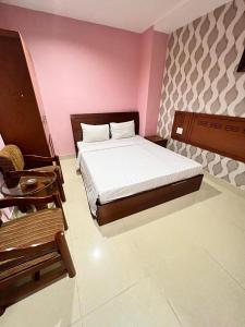 Postel nebo postele na pokoji v ubytování Bunny - Valentine Hotel - Bui Vien Street