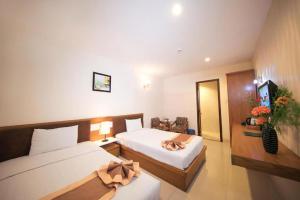 Postel nebo postele na pokoji v ubytování Bunny - Valentine Hotel - Bui Vien Street