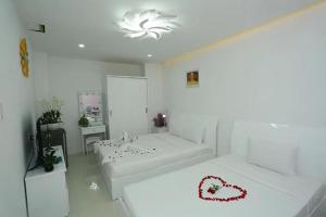 Postel nebo postele na pokoji v ubytování Bunny - Valentine Hotel - Bui Vien Street