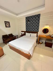 Postel nebo postele na pokoji v ubytování Bunny - Valentine Hotel - Bui Vien Street
