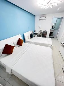 Postel nebo postele na pokoji v ubytování Bunny - Valentine Hotel - Bui Vien Street