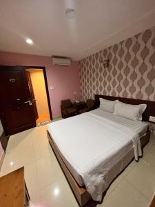 Postel nebo postele na pokoji v ubytování Bunny - Valentine Hotel - Bui Vien Street