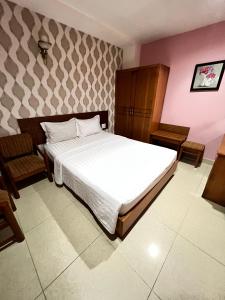 Postel nebo postele na pokoji v ubytování Bunny - Valentine Hotel - Bui Vien Street