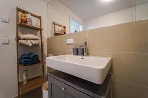 a bathroom with a white sink in a room at central Suite in Vienna