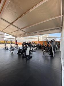 a gym with several treadmills and machines in a building at comfortable and cool suite in Polanco with GYM in Mexico City