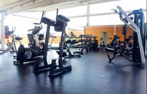 a gym with a bunch of treadms and machines at comfortable and cool suite in Polanco with GYM in Mexico City