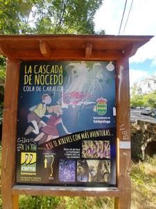 a poster on the side of a bus stop at Cómodo hogar en Cistierna in Cistierna