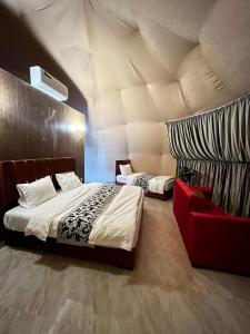 Кровать или кровати в номере Hashem desert camp