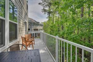 a balcony with a table and chairs on a house at Barefoot Resort & Golf. Near Barefoot Landing. in North Myrtle Beach