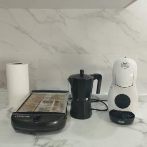 a blender and a toaster sitting on a counter at APARTAMENTO SOL in Chipiona