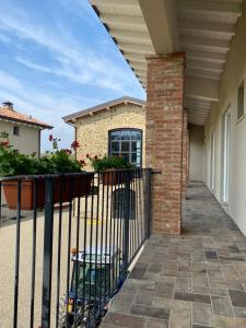 a wrought iron fence in front of a house at Fuoridicampo beige in Roncovetro