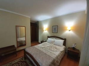 Postel nebo postele na pokoji v ubytování Hotel Peninsular