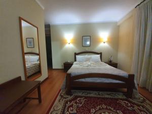 Postel nebo postele na pokoji v ubytování Hotel Peninsular