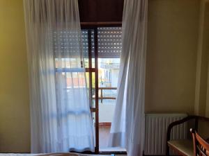 Postel nebo postele na pokoji v ubytování Hotel Peninsular