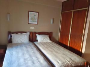 Postel nebo postele na pokoji v ubytování Hotel Peninsular