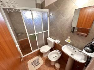 a small bathroom with a toilet and a sink at Los Preferidos in Colón +16 photos