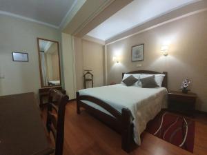 Postel nebo postele na pokoji v ubytování Hotel Peninsular