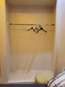 a closet with two hangers in a room at Marrakech Alal fasi in Marrakesh