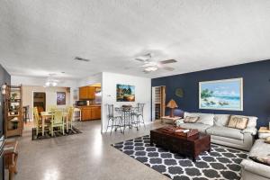 a living room with a couch and a table at Parrot Bay Retreat in Sarasota