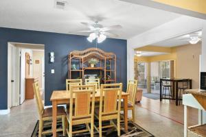 a dining room with a table and chairs at Parrot Bay Retreat in Sarasota