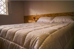 Voodi või voodid majutusasutuse New Hostel Usaquen Stanza toas