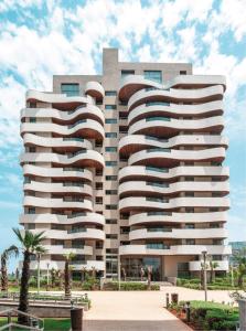 a large white building with a lot of windows at Appartement Ocean View - Marina Casablanca in Casablanca