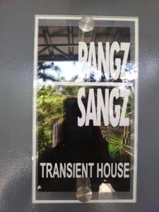 a sign on a wall that reads dancing sane transient house at Tiny House Loft Style in Digos