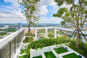 a view from the top of a building with trees at Once condo - Pattaya central location - Brand new apartments in Pattaya