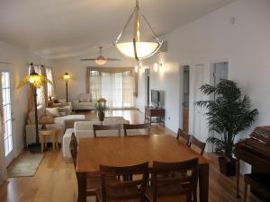 a dining room and living room with a dining table at Itʻs All About the Beach in Hauula