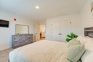 a white bedroom with a large bed and a dresser at Cozy Escape with Modern Comfort in Central Auburn - 1BD, 1BA Apartment in Auburn