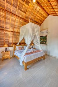 Postel nebo postele na pokoji v ubytování Bagia Bungalows + 58 fotografií