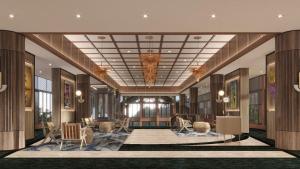 a rendering of a lobby with chairs and tables at Palm Garden Hotel, Putrajaya, a Tribute Portfolio Hotel in Putrajaya