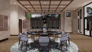 - une salle à manger avec une table et des chaises dans l'établissement Palm Garden Hotel, Putrajaya, a Tribute Portfolio Hotel, à Putrajaya