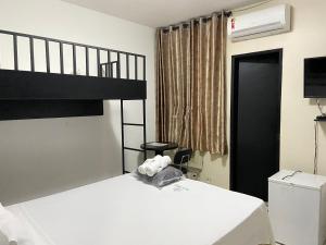 Katil dua tingkat atau katil-katil dua tingkat dalam bilik di Aton Plaza Hotel