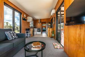 a living room with a couch and a table at Relaxing Getaway in Pohara in Pohara