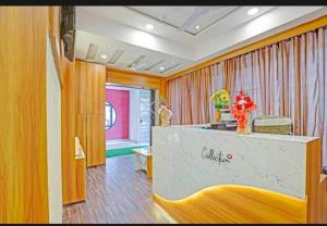 a hotel room with a counter with flowers on it at HOTEL STAY INN in Ahmedabad