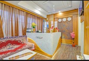 a room with a bed and a counter in a room at HOTEL STAY INN in Ahmedabad