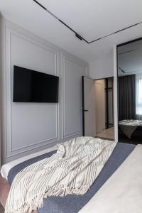 Ένα ή περισσότερα κρεβάτια σε δωμάτιο στο Апартаменти на Шевченка 60, ЖК "Семицвіт"