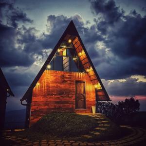 a small brick church with a window and a door at EagleRedCasino in Vagamon