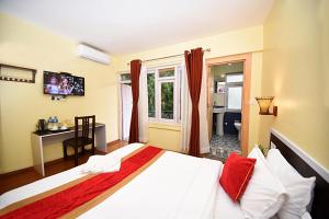 Letto o letti in una camera di Hotel Odyssey Nepal