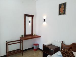 A bed or beds in a room at Nirwana Resort