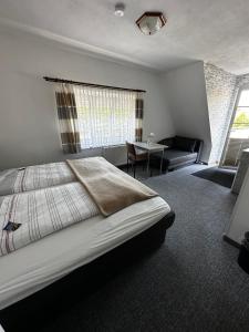Postel nebo postele na pokoji v ubytování Hotel Garni Nolting