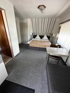 Postel nebo postele na pokoji v ubytování Hotel Garni Nolting