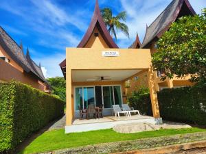 a house with a patio in front of it at Siam Royal View Resort Apartments in Ko Chang