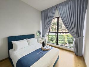 a bedroom with a bed and a large window at Country Garden by Antlerzone in Johor Bahru +150 photos