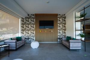 TV a/nebo společenská místnost v ubytování New River Hotel